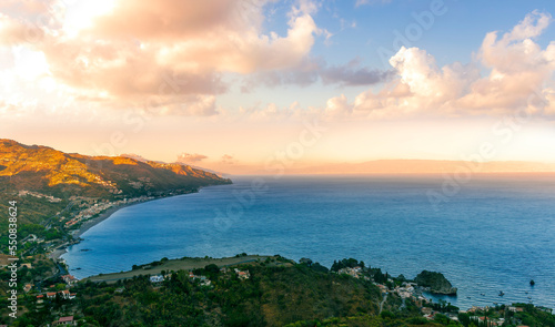 travel landscape scenic picture of beautiful highland mountain town in sunrise or sunset with sea shore on background