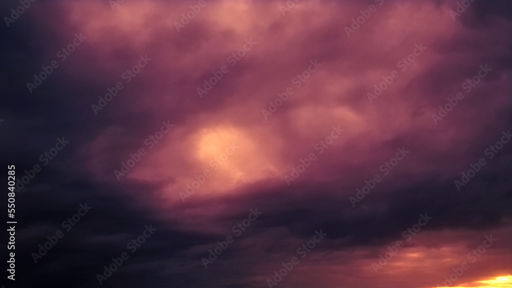 Obraz premium Dark purple and orange massive sundown clouds - abstract 3D rendering