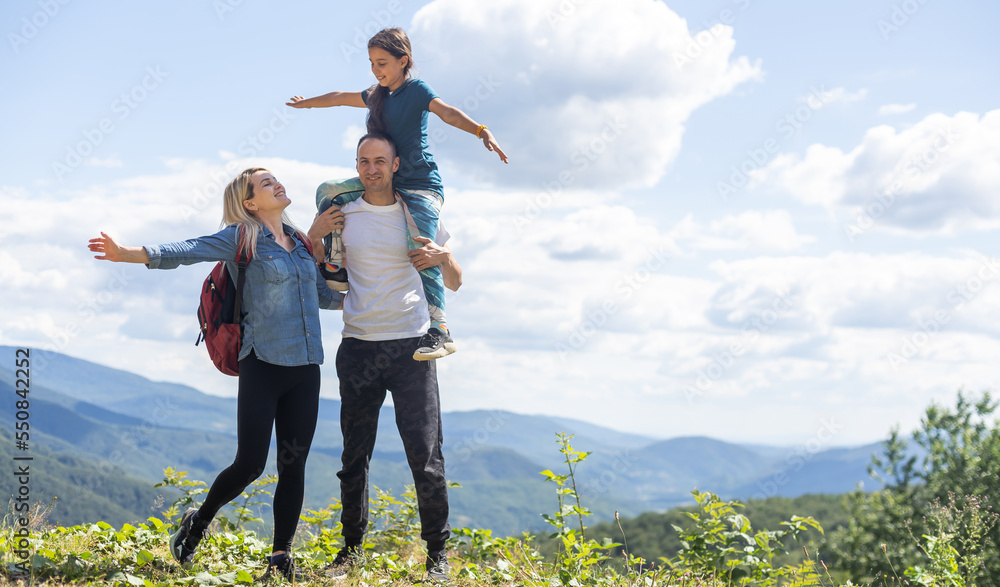Happy family: mother, father, child daughter on nature Happy family: mother, father, child daughter on nature