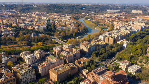 Aerial view over the Tiber River near Prati district in Rome, Italy. Autumn colors dye the trees along the river. © Stefano Tammaro