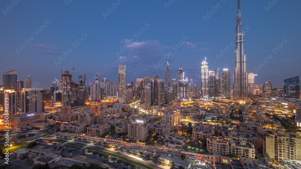 Fototapeta premium Dubai Downtown night to day timelapse with tallest skyscraper and other towers