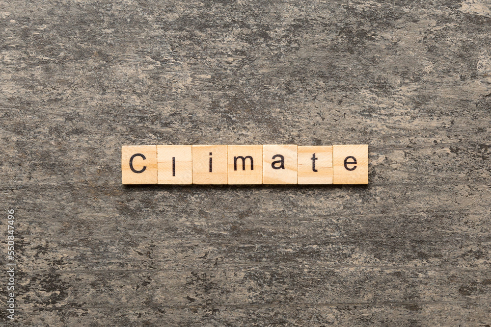 climate word written on wood block. climate text on cement table for your desing, concept climate word written on wood block. climate text on cement table for your desing, concept