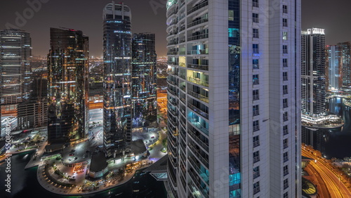 Canvas Print Tall residential buildings at JLT aerial night timelapse, part of the Dubai multi commodities centre mixed-use district