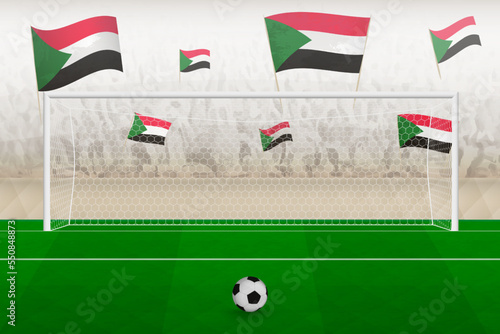 Sudan football team fans with flags of Sudan cheering on stadium, penalty kick concept in a soccer match.