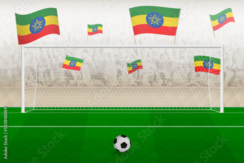 Ethiopia football team fans with flags of Ethiopia cheering on stadium, penalty kick concept in a soccer match.