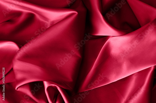 Fabric background in burgundy color.