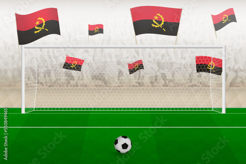 Angola football team fans with flags of Angola cheering on stadium, penalty kick concept in a soccer match.