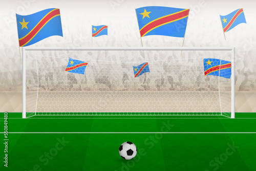 DR Congo football team fans with flags of DR Congo cheering on stadium, penalty kick concept in a soccer match.