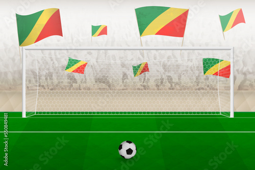 Congo football team fans with flags of Congo cheering on stadium, penalty kick concept in a soccer match.