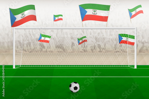 Equatorial Guinea football team fans with flags of Equatorial Guinea cheering on stadium, penalty kick concept in a soccer match.