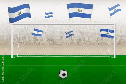 El Salvador football team fans with flags of El Salvador cheering on stadium, penalty kick concept in a soccer match.
