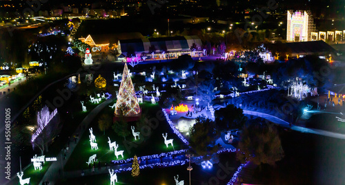 Aerial view of the Christmas decoration. City decorated with Christmas lights. Giant Christmas tree.