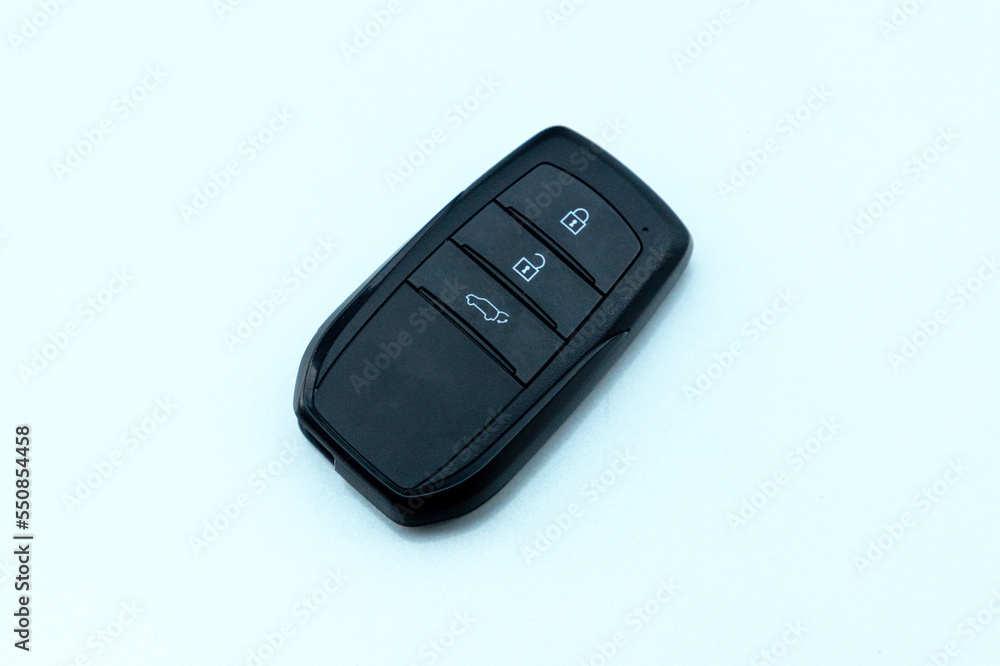Car key on the colorful background. Wireless remote control system.