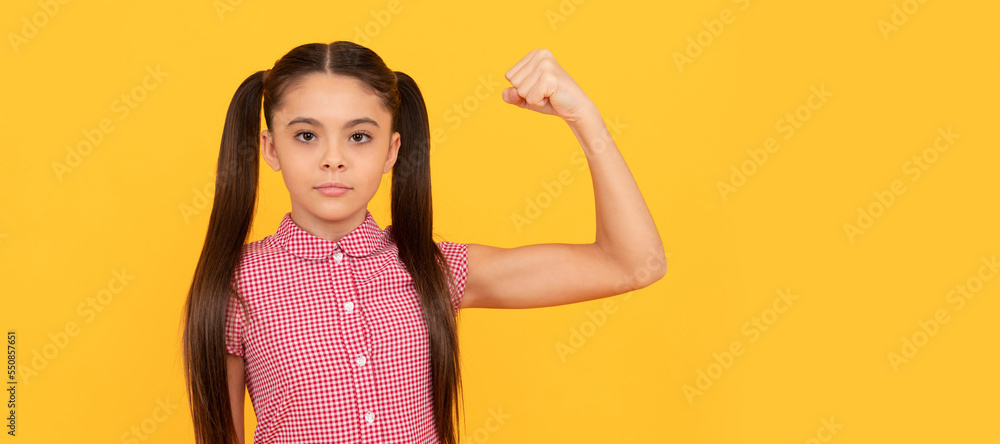 Serious girl child show power gesture flexing arm yellow background, strong. Child face, horizontal poster, teenager girl isolated portrait, banner with copy space. Serious girl child show power gesture flexing arm yellow background, strong. Child face, horizontal poster, teenager girl isolated portrait, banner with copy space.