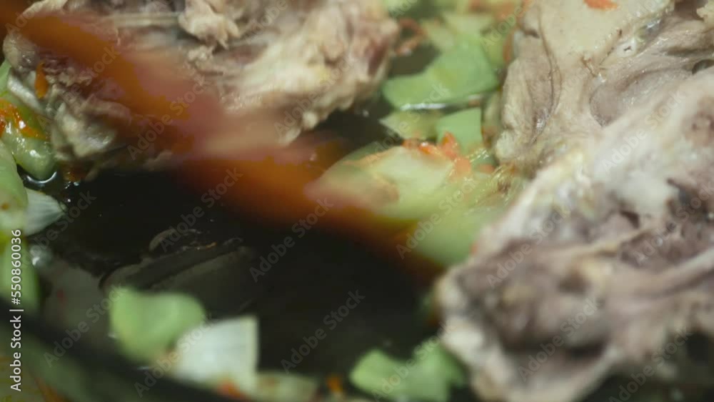 mixing chopped vegetables with meat in a frying pan, macro mixing chopped vegetables with meat in a frying pan, macro