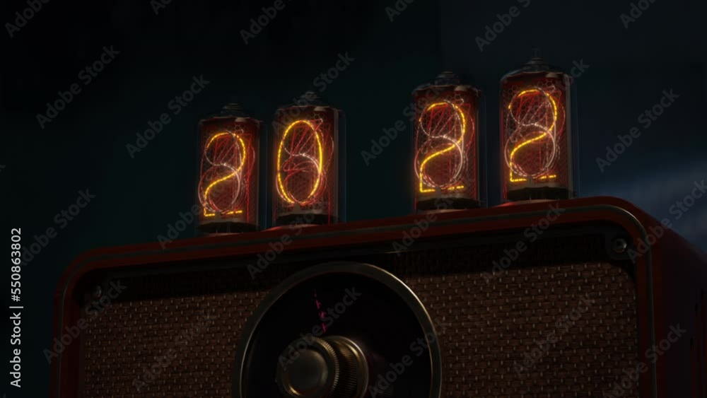 Vintage calendar clock with Nixie lamps and radio. Closeup. The camera