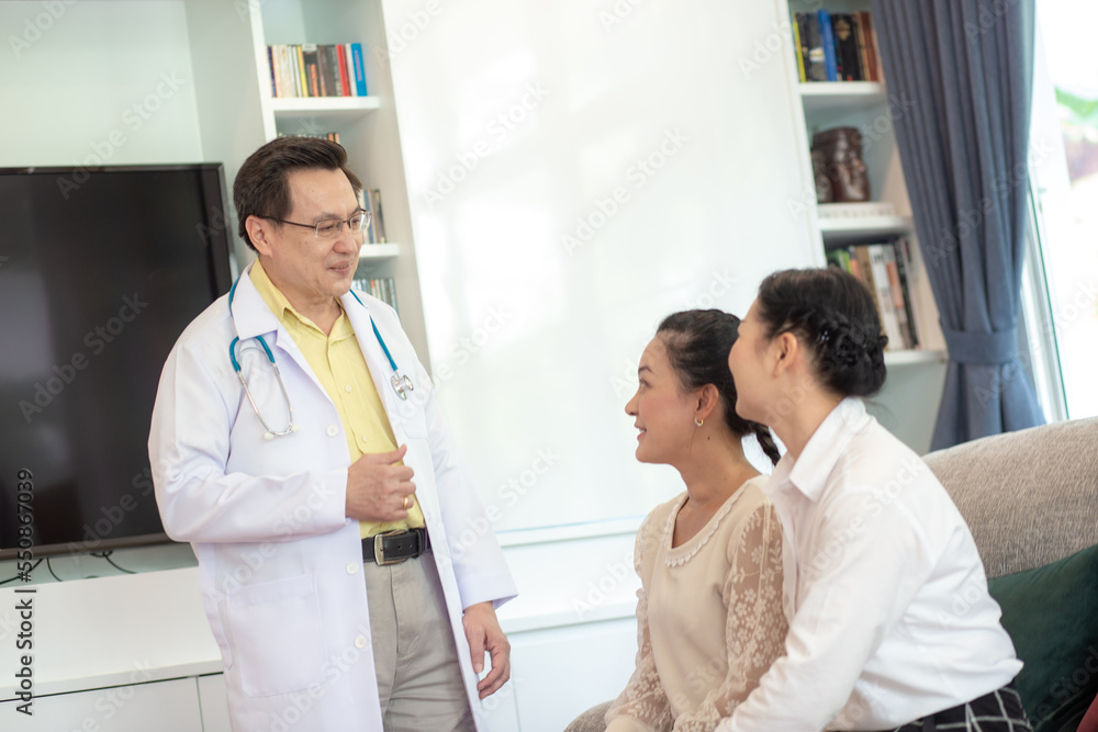Fototapeta premium Professional doctor talking with two patient woman consultant