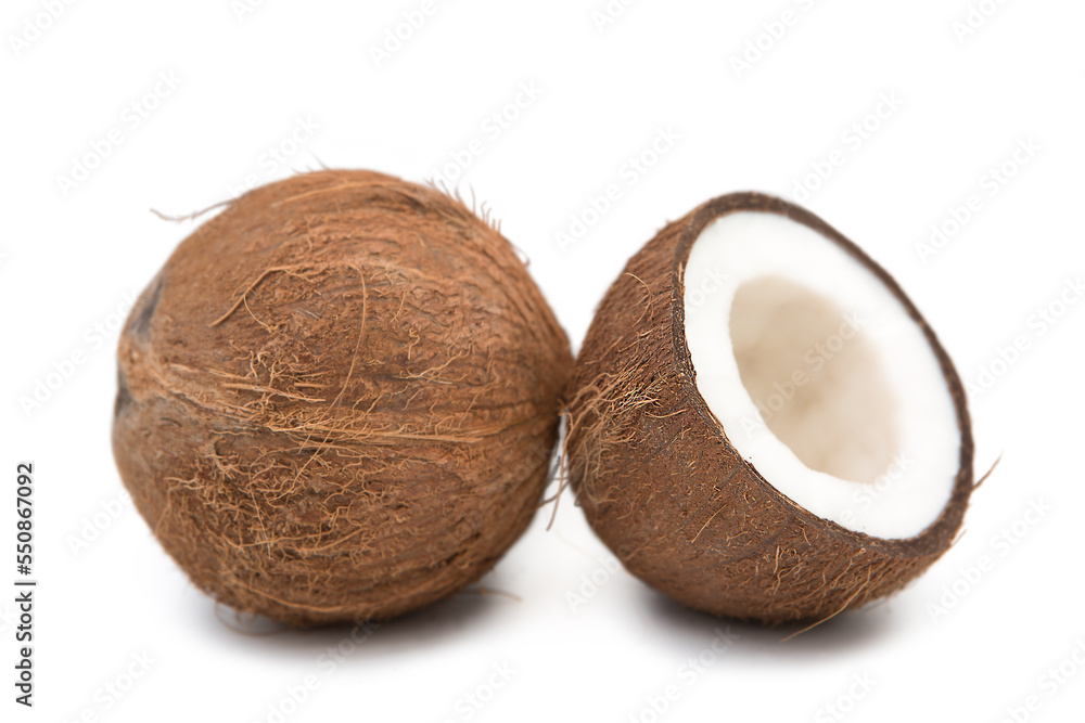 Coconuts whole and halved isolated on white background. Coconuts whole and halved isolated on white background.
