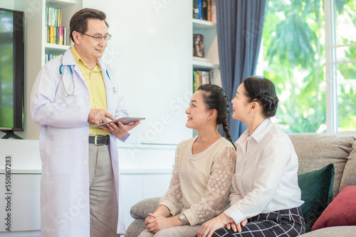 Professional doctor talking with two  patient woman consultant