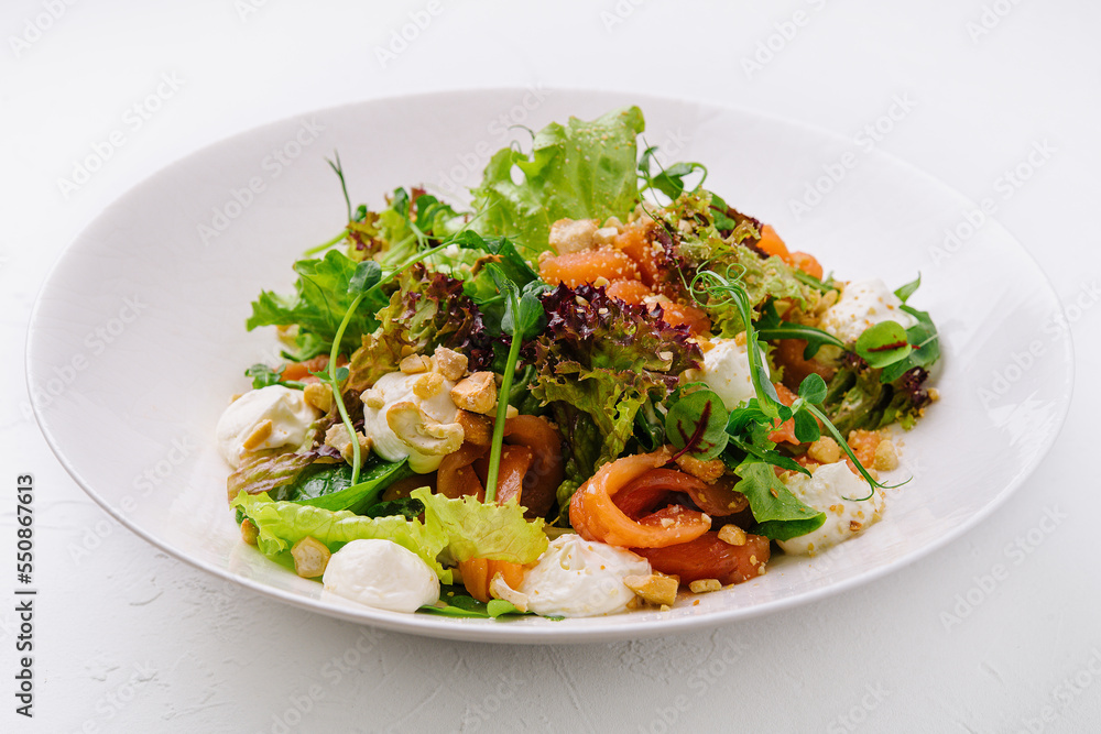 Fresh salad with cashew, mozzarella, pepper