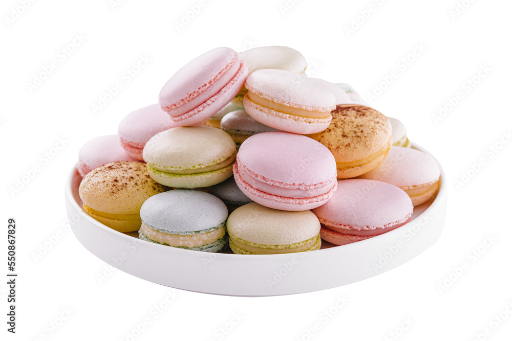 Multicolored macaroons on ceramic plate isolated on white Multicolored macaroons on ceramic plate isolated on white