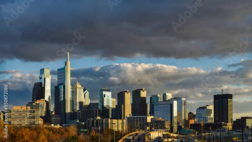 Skyline of Philadelphia  PA  USA at sunset under dark clouds  with copy space.