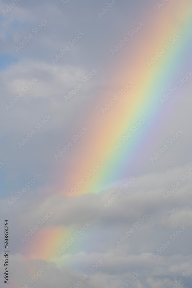 Close up of a beautiful rainbow between the clouds
