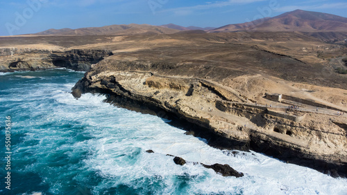 Aerial view of the sea caves of Ajuy, dug out of limestone cliffs on the western coast of Fuerteventura in the Canary Islands, Spain - photo