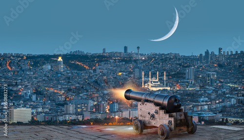 Leinwand Poster Ramadan Concept - Ramadan kareem cannon with crescent moon at amazing sunset - A
