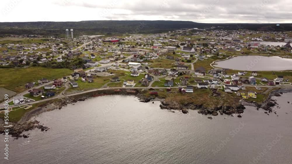 Aerial Bonavista Newfoundland cinematic view with distant water towers and popular landmarks on the Atlantic Coast of Canada. Aerial Bonavista Newfoundland cinematic view with distant water towers and popular landmarks on the Atlantic Coast of Canada.