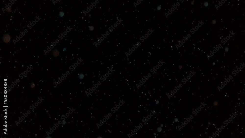 animation of shiny colorful particle spots scattering on a black background
animation of shiny colorful particle spots scattering on a black background