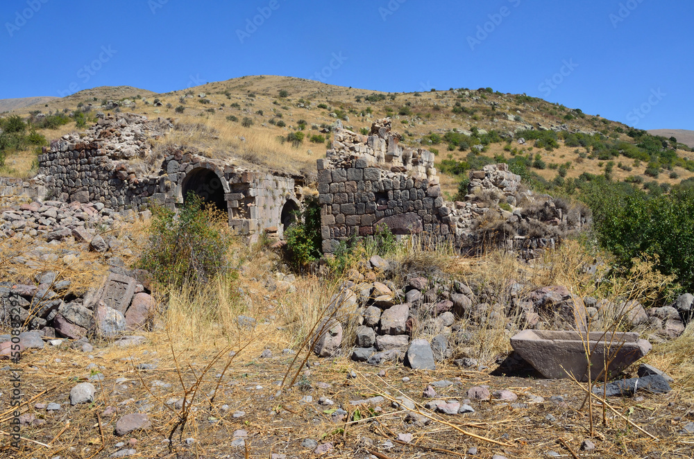  Ruins of buildings and khachkars 5-7 centuries in an ancient monastery Tsahats-kar in the mountains of Armenia