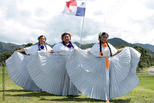 Three beautiful Panamanina, young women wearing the national dress outdoors