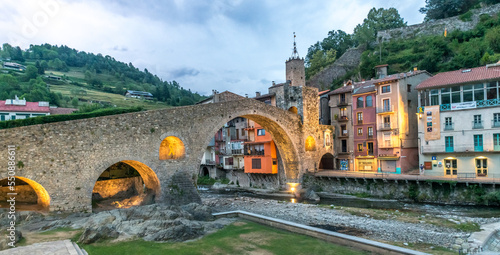 Camprodon, the medieval town and the old bridge in Catalonia Spain, seen at sunset photo