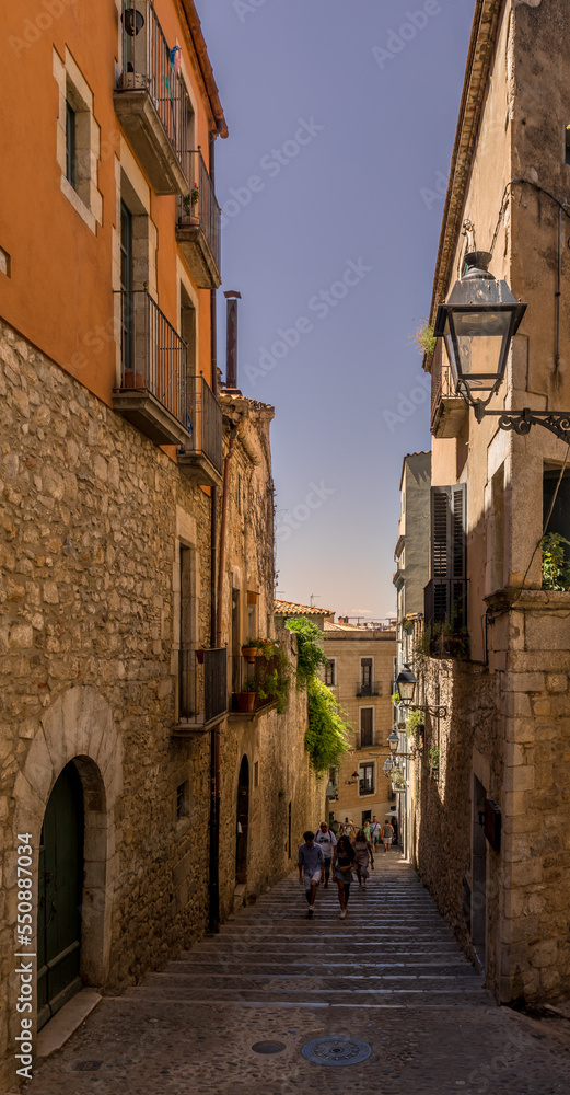 Narrow street in Girona, the beautiful medieval city in Catalonia Spain 