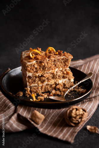 A slice of delicious homeade cake with walnus and cinnamon