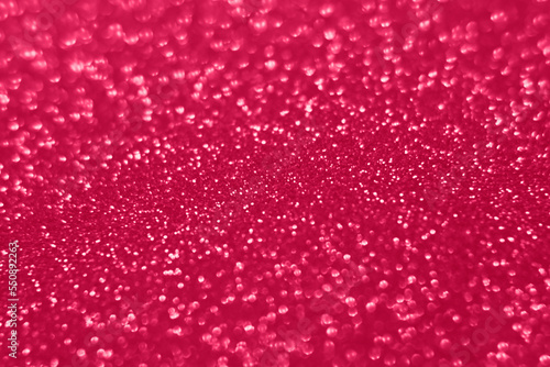 Viva Magenta lights bokeh background, Chrismas lights bokeh. Viva Magenta abstract background. Blurred and glowing lights. Viva Magenta bokeh lens effect from lighting spots.