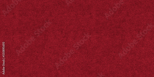 Seamless dark ruby red craft paper Christmas background texture. Rough textured thick cold pressed fibrous recycled cardboard or winter xmas holiday arts and craft card stock backdrop pattern..