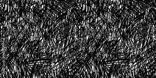 Seamless abstract chaotic ink pen or marker scribble background texture. Hand drawn fun playful trendy childish squiggly doodle drawing line art backdrop. Bold black isolated pattern overlay.. photo