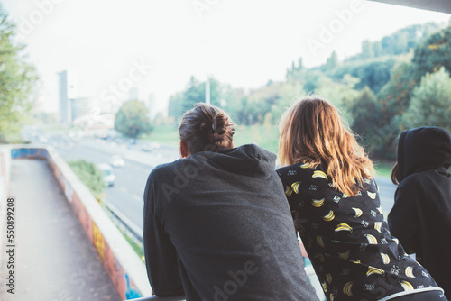Back view three people looking city together hope in future daydreaming