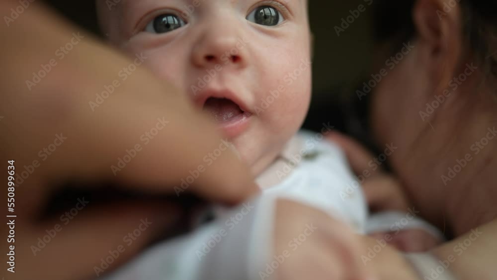 baby a newborn drooling from mouth. happy family kid dream concept. mom holds baby son in her arms, he is drooling, dad wipes saliva with a lifestyle handkerchief baby a newborn drooling from mouth. happy family kid dream concept. mom holds baby son in her arms, he is drooling, dad wipes saliva with a lifestyle handkerchief