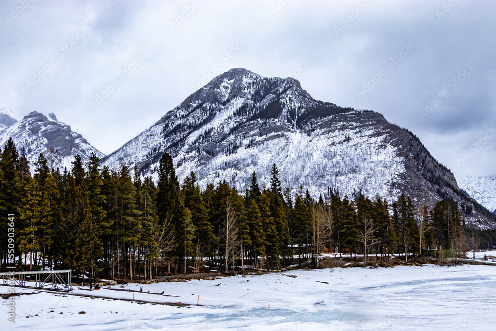 Ice is still frozen on Lake Minewnaka. Banff National Park, Alberta, Canada