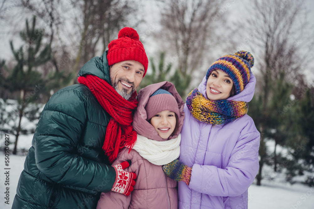 Fototapeta premium Photo of charming cheerful husband wife small kid wear windbreaker embracing enjoying time together outside urban city park