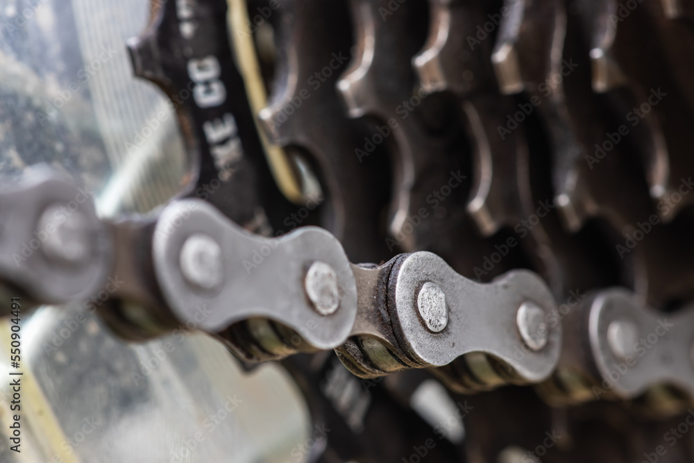 Cassette and chain of a mountain bike close-up on a black background. Cassette and chain of a mountain bike close-up on a black background.