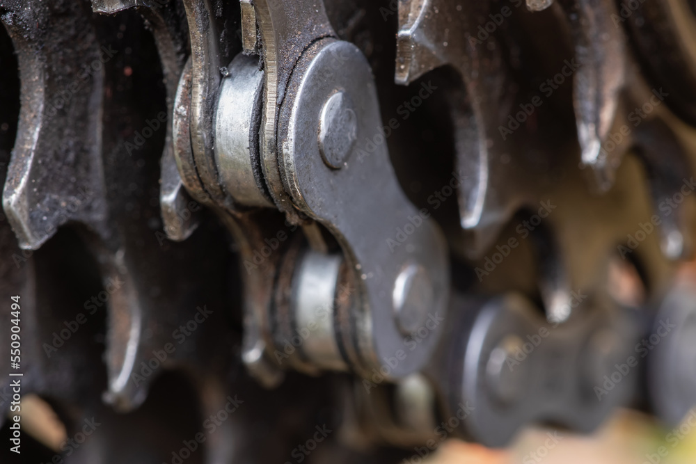 Cassette and chain of a mountain bike close-up on a black background. Cassette and chain of a mountain bike close-up on a black background.