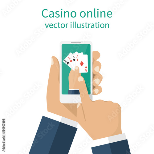 Casino online concept. Man gambler holding a phone in hand playing cards online. Modern technologies. Card game of poker.
