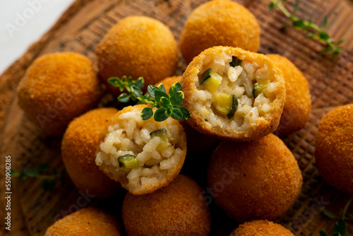Recipe for arancini with zucchini in a small format similar to a Spanish tapa crequette. photo