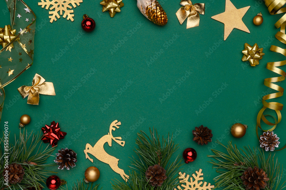 Christmas, winter composition. Flat lay of golden christmas decorations on green background.Christmas,new year concept