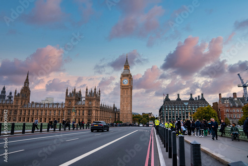 Beautiful Westminster in London with people crossing the bridge. Amazing details after renovation of the Big Ben. © Aerial Film Studio