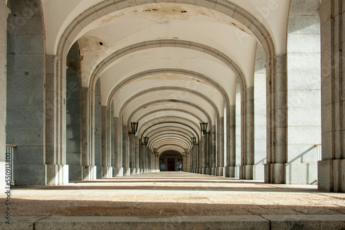 corridor of arches built of granite stone from the Sierra de Guadarrama  as well as the access steps